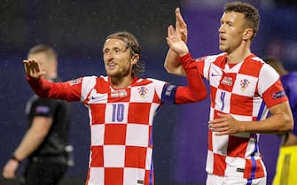 epa08736128 Croatia's Luka Modric (L) and Croatia's Ivan Perisic (R) celebrate the team's 1-0 goal during the UEFA Nations League group A3 soccer match between Croatia and Sweden in Split, Croatia, 11 October 2020.  EPA/ANTONIO BAT