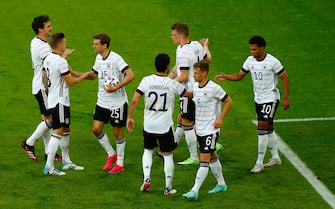 Germany's forward Thomas Mueller (3L) celebrates scoring the 3-0 goal with teammates during the friendly football match between Germany and Latvia in Duesseldorf, western Germany, on June 7, 2021, in preparation for the UEFA European Championships. (Photo by THILO SCHMUELGEN / POOL / AFP) (Photo by THILO SCHMUELGEN/POOL/AFP via Getty Images)