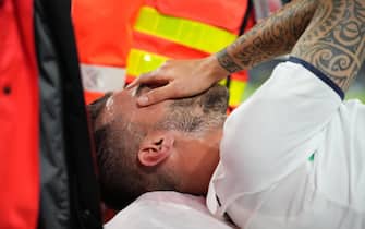 epa09319240 Leonardo Spinazzola of Italy reacts as he is carried off the pitch on a strechter after an injury during the UEFA EURO 2020 quarter final match between Belgium and Italy in Munich, Germany, 02 July 2021.  EPA/Matthias Schrader / POOL (RESTRICTIONS: For editorial news reporting purposes only. Images must appear as still images and must not emulate match action video footage. Photographs published in online publications shall have an interval of at least 20 seconds between the posting.)