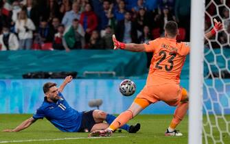 Italy's forward Domenico Berardi (L) scores past Spain's goalkeeper Unai Simon (R) from an offside position during the UEFA EURO 2020 semi-final football match between Italy and Spain at Wembley Stadium in London on July 6, 2021. (Photo by Frank Augstein / POOL / AFP) (Photo by FRANK AUGSTEIN/POOL/AFP via Getty Images)