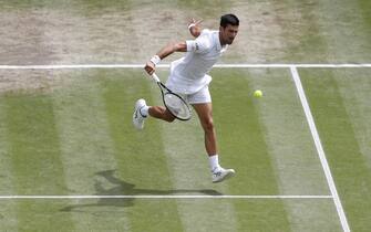 epa09337266 Novak Djokovic of Serbia in action against Matteo Berrettini of Italy during the men's final at the Wimbledon Championships, Wimbledon, Britain 11 July 2021.  EPA/Peter Nicholls / POOL