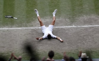 epa09337714 Novak Djokovic of Serbia celebrates after winning the men's final against Matteo Berrettini of Italy at the Wimbledon Championships, Wimbledon, Britain 11 July 2021.  EPA/Peter Nicholls / POOL   EDITORIAL USE ONLY