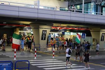 Italian fans celebrates outside the Fiumicino airport