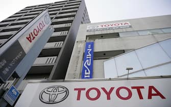 epa09000537 The Toyota Motor logo hangs outside the carmaker's retailer in Tokyo, Japan, 10 February 2021. Toyota Motor Corp. announced its financial forecast for the fiscal year 2021.  EPA/FRANCK ROBICHON