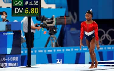 epa09370179 Simone Biles of the USA performs on the Vault during the Women's Team final during the Artistic Gymnastics events of the Tokyo 2020 Olympic Games at the Ariake Gymnastics Centre in Tokyo, Japan, 27 July 2021.  EPA/HOW HWEE YOUNG