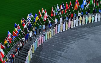 Athletes delegations arrive with their national flag during the closing ceremony of the Tokyo 2020 Olympic Games, at the Olympic Stadium, in Tokyo, on August 8, 2021. (Photo by Antonin THUILLIER / AFP) (Photo by ANTONIN THUILLIER/AFP via Getty Images)