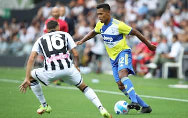 Udinese's Nahuel Molina (L) and Juventus's Alex Sandro in action during the Italian Serie A soccer match Udinese Calcio vs Juventus FC at the Friuli - Dacia Arena stadium in Udine, Italy, 22 August 2021. ANSA/GABRIELE MENIS