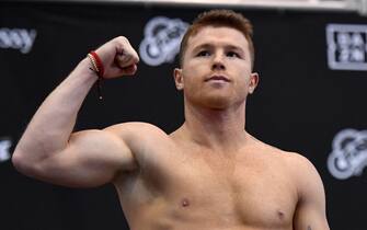 LAS VEGAS, NEVADA - NOVEMBER 01:  Boxer Canelo Alvarez poses on the scale during his official weigh-in at MGM Grand Garden Arena on November 1, 2019 in Las Vegas, Nevada. Alvarez, who is making his debut at light heavyweight, will challenge WBO light heavyweight champion Sergey Kovalev for his title at MGM Grand Garden Arena in Las Vegas on November 2.  (Photo by Ethan Miller/Getty Images)