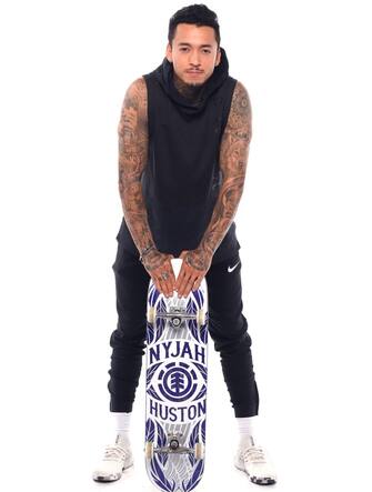 WEST HOLLYWOOD, CALIFORNIA - NOVEMBER 21: Skateboarder Nyjah Huston poses for a portrait during the Team USA Tokyo 2020 Olympics shoot on November 21, 2019 in West Hollywood, California. (Photo by Harry How/Getty Images)