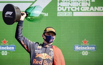 epa09449504 Dutch Max Verstappen (Red Bull Racing) celebrates winning the Dutch Formula One Grand Prix at Zandvoort, the Netherlands, 05 September 2021.  EPA/KOEN VAN WEEL
