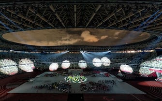 epa09448884 A handout photo made available by OIS/IOC shows athletes watching from seats on the Field of Play whilst performers and a light show entertain them in the This is Tokyo segment of Closing Ceremony for the Tokyo 2020 Paralympic Games, Tokyo, Japan, 05 September 2021.  EPA/Joe Toth for OIS HANDOUT   EDITORIAL USE ONLY/NO SALES