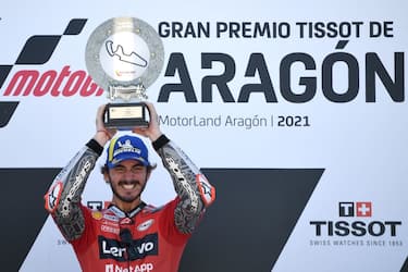 Ducati Italian rider Francesco Bagnaia celebrates on the podium after winning the Moto Grand Prix of Aragon at the Motorland circuit in Alcaniz on September 12, 2021. (Photo by LLUIS GENE / AFP) (Photo by LLUIS GENE/AFP via Getty Images)