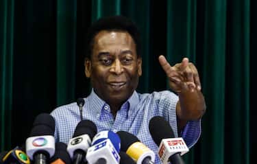 Brazilian football legend Edson Arantes do Nascimento, known as Pele, offers a press conference after being released from hospital in Sao Paulo, Brazil, on December 9, 2014. Pele has recovered well from his kidney ailment and left hospital on Tuesday, after been treated for two weeks.  AFP PHOTO / Miguel SCHINCARIOL (Photo by Miguel Schincariol / AFP) (Photo by MIGUEL SCHINCARIOL/AFP via Getty Images)