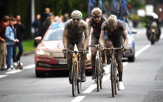 ROUBAIX, FRANCE - OCTOBER 03: (L-R) Sonny Colbrelli of Italy and Team Bahrain Victorious, Florian Vermeersch of Belgium and Team Lotto Soudal and Mathieu Van Der Poel of Netherlands and Team Alpecin-Fenix covered in mud compete in the breakaway during the 118th Paris-Roubaix 2021 - Men's Eilte a 257,7km race from Compiègne to Roubaix / #ParisRoubaix / on October 03, 2021 in Roubaix, France. (Photo by Tim de Waele/Getty Images)
