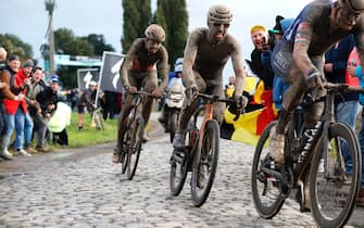 ROUBAIX, FRANCE - OCTOBER 03: Sonny Colbrelli of Italy and Team Bahrain Victorious covered in mud competes in the breakaway through cobblestones sector during the 118th Paris-Roubaix 2021 - Men's Eilte a 257,7km race from Compiègne to Roubaix / #ParisRoubaix / on October 03, 2021 in Roubaix, France. (Photo by Bas Czerwinski/Getty Images)