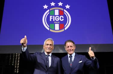 MILAN, ITALY - OCTOBER 04: President oF FIGC Gabriele Gravina and Lapo Elkann pose for a photo during the unveiling of the FIGC new institutional Logo at Garage Italia on October 04, 2021 in Milan, Italy. (Photo by Vincenzo Lombardo/Getty Images)