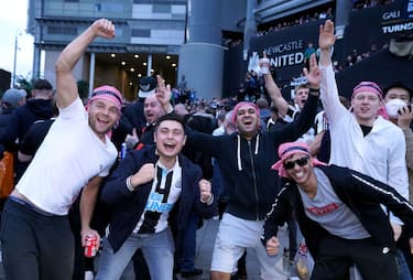 Newcastle United fans celebrate at St James' Park following the announcement that The Saudi-led takeover of Newcastle has been approved. Picture date: Thursday October 7, 2021. (Photo by Owen Humphreys/PA Images via Getty Images)