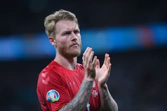 1327533694 LONDON, ENGLAND - JULY 07: Simon Kjaer of Denmark applauds the fans following defeat in the UEFA Euro 2020 Championship Semi-final match between England and Denmark at Wembley Stadium on July 07, 2021 in London, England. (Photo by Laurence Griffiths/Getty Images)