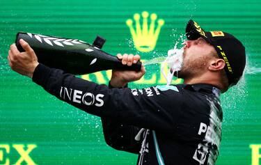ISTANBUL, TURKEY - OCTOBER 10: Race winner Valtteri Bottas of Finland and Mercedes GP celebrates on the podium during the F1 Grand Prix of Turkey at Intercity Istanbul Park on October 10, 2021 in Istanbul, Turkey. (Photo by Bryn Lennon/Getty Images)