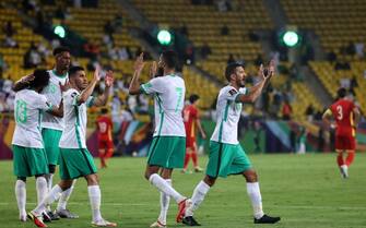 Saudi Arabia's players celebrate during the 2022 Qatar football World Cup Asian qualification match between Saudi Arabia and Vietnam, at the Mrsool Park Stadium in Riyadh, on September 2, 2021. (Photo by Fayez Nureldine / AFP) (Photo by FAYEZ NURELDINE/AFP via Getty Images)