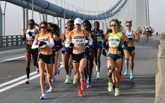 Women elite runners crossthe Verrazzano-Narrows Bridge during the 2021 TCS New York City Marathon in New York on November 7, 2021. - After a forced break in 2020, the New York City Marathon is back on for its 50th edition, and with it the countless opportunities to run it for charity, an industry that has become a staple, and hopes to take off again after the pandemic. (Photo by ANGELA  WEISS / AFP) (Photo by ANGELA  WEISS/AFP via Getty Images)