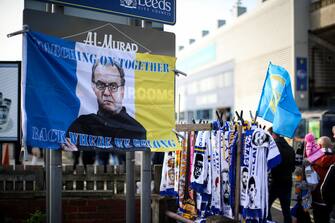 LEEDS, ENGLAND - NOVEMBER 07: A flag of Marcelo Bielsa the head coach / manager of Leeds United is seen art a merchandise stall ahead of the Premier League match between Leeds United  and  Leicester City at Elland Road on November 7, 2021 in Leeds, England. (Photo by Robbie Jay Barratt - AMA/Getty Images)