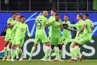 Wolfsburg's German midfielder Ridle Baku (C) celebrates scoring the opening goal with his team mates during the UEFA Champions League group G football match VfL Wolfsburg v FC Salzburg on November 2, 2021 in Wolfsburg, northern Germany. (Photo by Ronny HARTMANN / AFP) (Photo by RONNY HARTMANN/AFP via Getty Images)