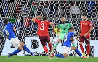 Switzerland's Silvan Widmer (C) scores the 0-1 goal during the 2022 FIFA World Cup European qualifying  Group C soccer match between Italy and Switzerland at the Olimpico stadium in Rome, Italy, 12 November 2021.  ANSA/ETTORE FERRARI