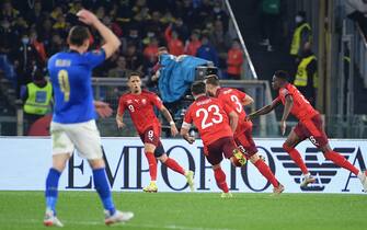 Switzerland's Silvan Widmer (2R) celebrates after scoring the 0-1 goal with his teammates during the 2022 FIFA World Cup European qualifying  Group C soccer match between Italy and Switzerland at the Olimpico stadium in Rome, Italy, 12 November 2021.  ANSA/ETTORE FERRARI