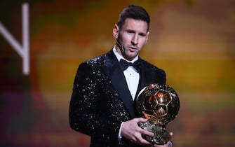 Paris Saint-Germain's Argentine forward Lionel Messi poses after being awarded the the Ballon d'Or award during  the 2021 Ballon d'Or France Football award ceremony at the Theatre du Chatelet in Paris on November 29, 2021. (Photo by FRANCK FIFE / AFP) (Photo by FRANCK FIFE/AFP via Getty Images)