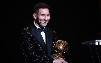 Paris Saint-Germain's Argentine forward Lionel Messi poses after being awarded the the Ballon d'Or award during the 2021 Ballon d'Or France Football award ceremony at the Theatre du Chatelet in Paris on November 29, 2021. (Photo by FRANCK FIFE / AFP) (Photo by FRANCK FIFE/AFP via Getty Images)