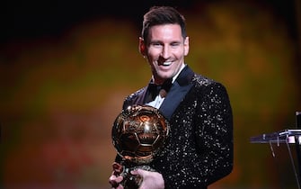 Paris Saint-Germain's Argentine forward Lionel Messi reacts after being awarded the the Ballon d'Or award during the 2021 Ballon d'Or France Football award ceremony at the Theatre du Chatelet in Paris on November 29, 2021. (Photo by FRANCK FIFE / AFP) (Photo by FRANCK FIFE/AFP via Getty Images)