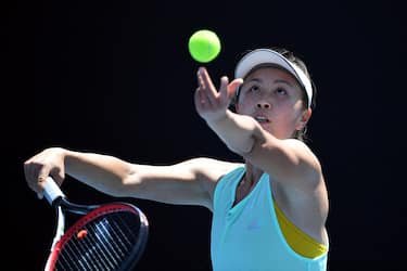(FILES) This file photo taken on January 13, 2019 shows China's Peng Shuai serving the ball during a practice session ahead of the Australian Open tennis tournament in Melbourne. - China's former vice premier Zhang Gaoli (2013-18) has been accused by tennis champion Peng Shuai of forcing her to have sex during a long-term on-off relationship, in a message promptly censored on Chinese social networks. (Photo by William WEST / AFP) / TO GO WITH Tennis-CHN-China-politics-Zhang,PROFILE by Patrick BAERT
IMAGE RESTRICTED TO EDITORIAL USE - STRICTLY NO COMMERCIAL USE