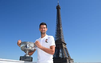 (210615) -- PARIS, June 15, 2021 (Xinhua) -- Serbia's Novak Djokovic poses with the trophy in front of the Eiffel tower, in Paris, France, June 14, 2021, one day after winning the Roland Garros 2021 French Open tennis tournament. (Photo provided by Corinne Dubreuil/FFT/Xinhua) - C OrinneDubreuilgaojingtonglian -//CHINENOUVELLE_XxjpsgE007083_20210615_PEPFN0A001/2106150829/Credit:CHINE NOUVELLE/SIPA/2106150836