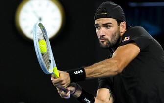 epa09703905 Matteo Berrettini of Italy in action against Pablo Carreno Busta of Spain during their 4th round match on Day 7 of the Australian Open at Melbourne Park in Melbourne, Australia, 23 January 2022.  EPA/DEAN LEWINS AUSTRALIA AND NEW ZEALAND OUT