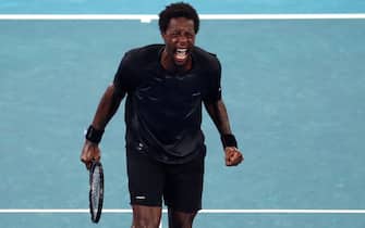epa09703778 Gael Monfils of France celebrates after winning the fourth round match against Miomir Kecmanovic of Serbia at the Australian Open Grand Slam tennis tournament in Melbourne, Australia, 23 January 2022.  EPA/JASON O'BRIEN