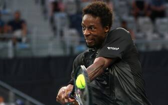 epa09703792 Gael Monfils of France in action against Miomir Kecmanovic of Serbia during the fourth round match at the Australian Open Grand Slam tennis tournament in Melbourne, Australia, 23 January 2022.  EPA/JASON O'BRIEN