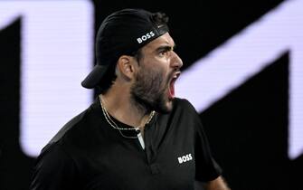 epa09707782 Matteo Berrettini of Italy celebrates winning the first set during his Men s singles quarterfinal match against Gael Monfils of France at the Australian Open Grand Slam tennis tournament at Melbourne Park, in Melbourne, Australia, 25 January 2022.  EPA/DEAN LEWINS AUSTRALIA AND NEW ZEALAND OUT