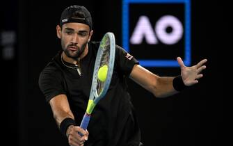 epa09707715 Matteo Berrettini of Italy plays a shot during his Men s singles quarterfinal match against Gael Monfils of France at the Australian Open Grand Slam tennis tournament at Melbourne Park, in Melbourne, Australia, 25 January 2022.  EPA/DEAN LEWINS AUSTRALIA AND NEW ZEALAND OUT