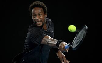 epa09707720 Gael Monfils of France plays a shot during his Men s singles quarterfinal match against Matteo Berrettini of Italy  at the Australian Open Grand Slam tennis tournament at Melbourne Park, in Melbourne, Australia, 25 January 2022.  EPA/DEAN LEWINS AUSTRALIA AND NEW ZEALAND OUT