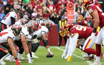 Nov 14, 2021; Landover, MD USA;  A general view of the line of scrimmage with quarterback Tom Brady (12) and the Tampa Bay Buccaneers on offense against the Washington Football Team during an NFL game at FedEx Field.  Washington beat the Buccaneers 29-19. (Steve Jacobson/Image of Sport/Sipa USA)
