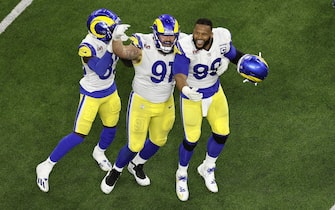 epa09754440 Los Angeles Rams Greg Gaines (L) and Aaron Donald (R) celebrate after stopping the Cincinnati Bengals on fourth down with second left in Super Bowl LVI at SoFi Stadium in Inglewood, California, USA, 13 February 2022. The annual Super Bowl is the Championship game of the NFL between the AFC Champion and the NFC Champion and has been held every year since January of 1967.  EPA/ETIENNE LAURENT