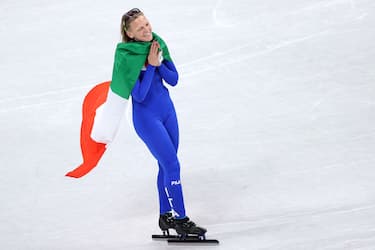 BEIJING, CHINA - FEBRUARY 16: Arianna Fontana of Italy celebrates winning the Silver medal during the Women's 1500m Final A on day twelve of the Beijing 2022 Winter Olympic Games at Capital Indoor Stadium on February 16, 2022 in Beijing, China. (Photo by Jean Catuffe/Getty Images)