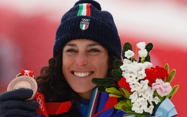 epa09764850 Bronze medalist Federica Brignone of Italy celebrates on the podium for the Women's  Alpine Combined competion of the Beijing 2022 Olympic Games at the Yanqing National Alpine Ski Centre Skiing, Beijing municipality, China, 17 February 2022.  EPA/GUILLAUME HORCAJUELO