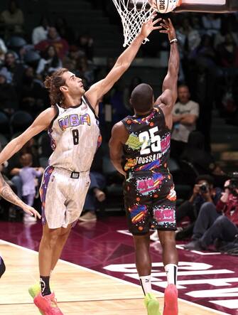 CLEVELAND, OHIO - FEBRUARY 18: Alex Toussaint #25 of Team Walton shoots a layup past Gianmarco Tamberi #8 of Team Nique during the Ruffles NBA All-Star Celebrity Game during the 2022 NBA All-Star Weekend at Wolstein Center on February 18, 2022 in Cleveland, Ohio. NOTE TO USER: User expressly acknowledges and agrees that, by downloading and/or using this Photograph, user is consenting to the terms and conditions of the Getty Images License Agreement.   Arturo Holmes/Getty Images/AFP
== FOR NEWSPAPERS, INTERNET, TELCOS & TELEVISION USE ONLY ==