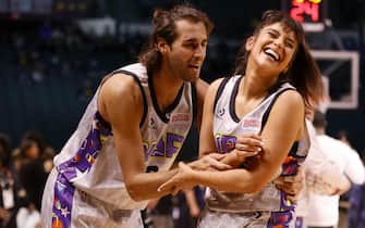 CLEVELAND, OHIO - FEBRUARY 18: (L-R) Gianmarco Tamberi #8 and Anjali Ranadive #33 are seen in action during the Ruffles NBA All-Star Celebrity Game during the 2022 NBA All-Star Weekend at Wolstein Center on February 18, 2022 in Cleveland, Ohio. NOTE TO USER: User expressly acknowledges and agrees that, by downloading and or using this photograph, User is consenting to the terms and conditions of the Getty Images License Agreement.   Tim Nwachukwu/Getty Images/AFP
== FOR NEWSPAPERS, INTERNET, TELCOS & TELEVISION USE ONLY ==