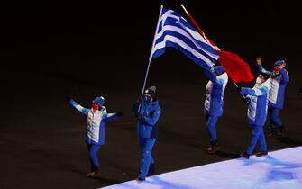 BEIJING, CHINA - FEBRUARY 20: Flagbearer Ioannis Antoniou of Team Greece during the Beijing 2022 Winter Olympics Closing Ceremony on Day 16 of the Beijing 2022 Winter Olympics at Beijing National Stadium on February 20, 2022 in Beijing, China. (Photo by James Chance/Getty Images)