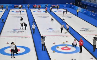 A general view shows the arena during the women's round robin session 12 games of the Beijing 2022 Winter Olympic Games curling competition, between (From L) players of Russia's Olympic Committee and Britain, Denmark and Canada, and South Korea and Sweden, at the National Aquatics Centre in Beijing on February 17, 2022. (Photo by Lillian SUWANRUMPHA / AFP) (Photo by LILLIAN SUWANRUMPHA/AFP via Getty Images)