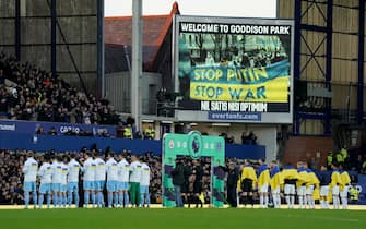 epa09787997 Players of Manchester City (L) and Everton (R) line up in front of an anti war message prior to the English Premier League soccer match between Everton FC and Manchester City in Liverpool, Britain, 26 February 2022.  EPA/ANDREW YATES EDITORIAL USE ONLY. No use with unauthorized audio, video, data, fixture lists, club/league logos or 'live' services. Online in-match use limited to 120 images, no video emulation. No use in betting, games or single club/league/player publications.