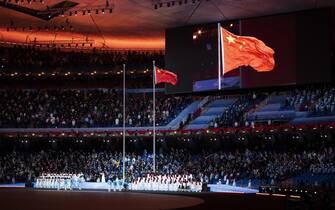 epa09800911 The flag of China flies at the Opening Ceremony of the Beijing 2022 Paralympic Winter Games at National Stadium, also known as Bird's Nest, in Beijing, China, 04 March 2022.  EPA/ENNIO LEANZA